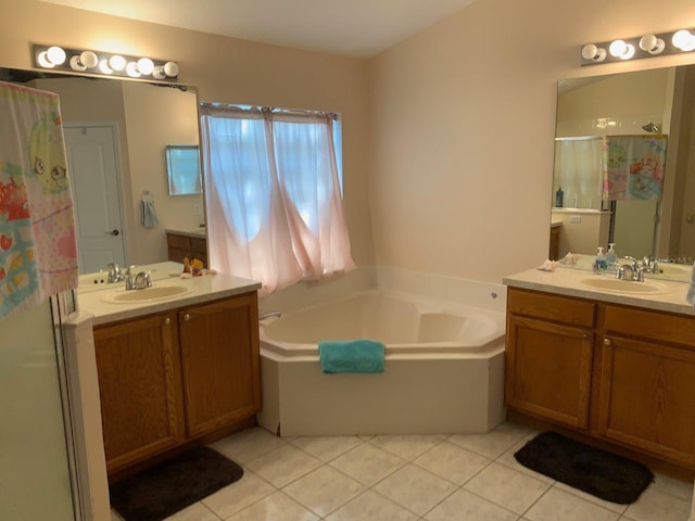 bathroom featuring plus walk in shower, vanity, and tile patterned floors