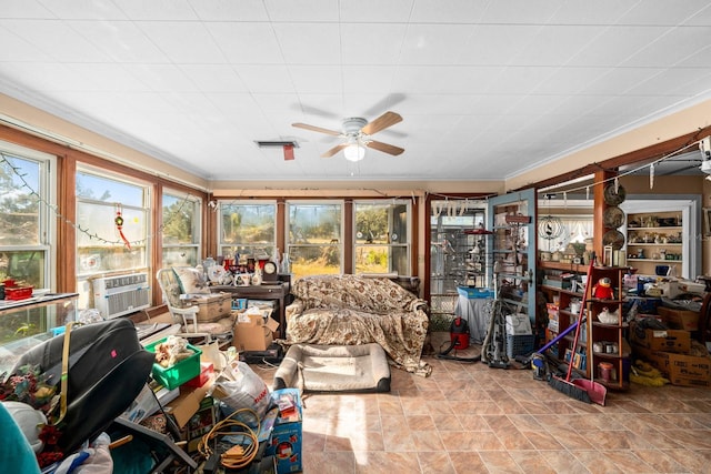 sunroom with ceiling fan and cooling unit