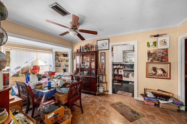 dining room with ceiling fan and ornamental molding