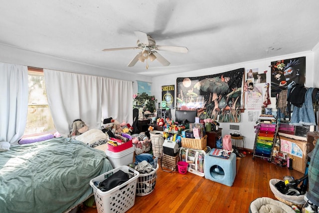 bedroom with hardwood / wood-style flooring and ceiling fan