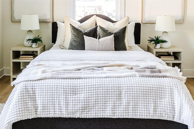 bedroom with hardwood / wood-style floors