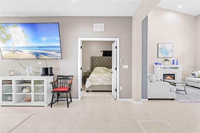 living room with light tile patterned floors and vaulted ceiling