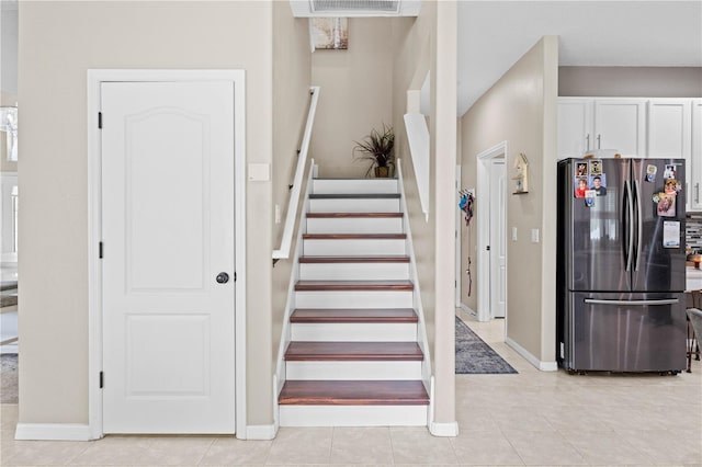 staircase with tile patterned floors