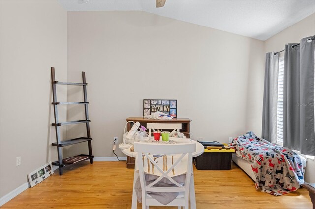 home office featuring wood-type flooring and lofted ceiling