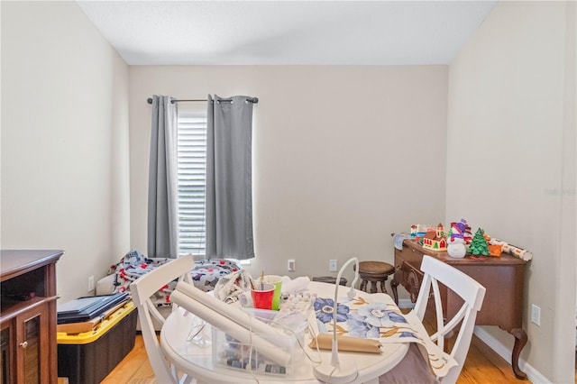 bedroom with light hardwood / wood-style floors