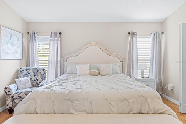 bedroom with light wood-type flooring