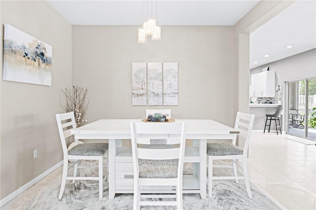 dining space with an inviting chandelier