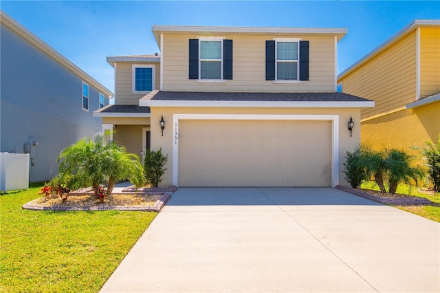 front facade with a garage and a front lawn