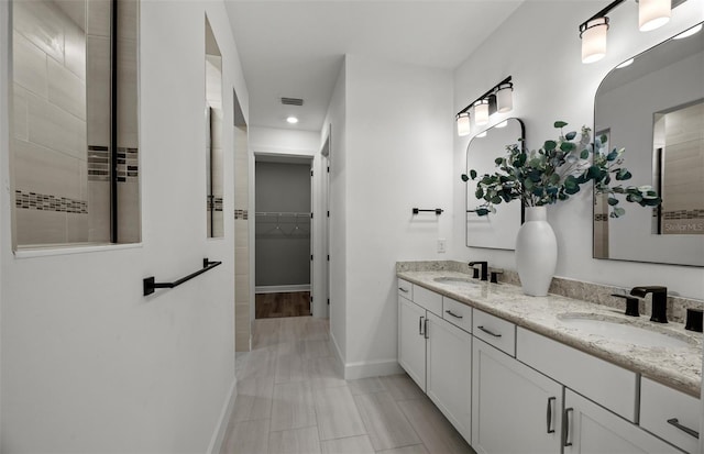 bathroom featuring vanity and hardwood / wood-style flooring