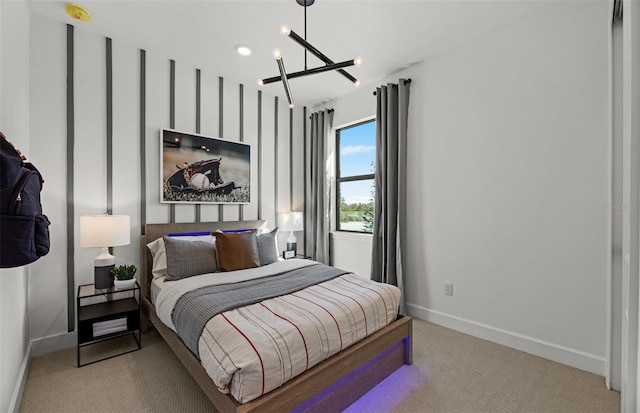 bedroom with light carpet and an inviting chandelier