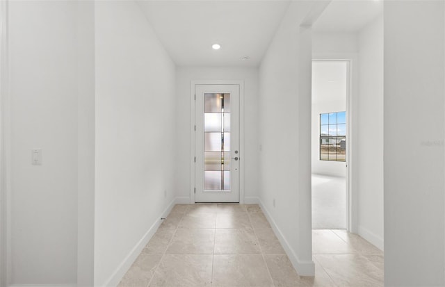 entryway featuring light tile patterned floors