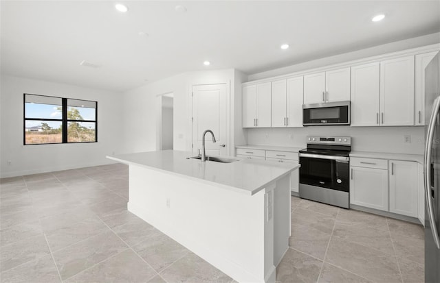 kitchen featuring appliances with stainless steel finishes, sink, and white cabinets