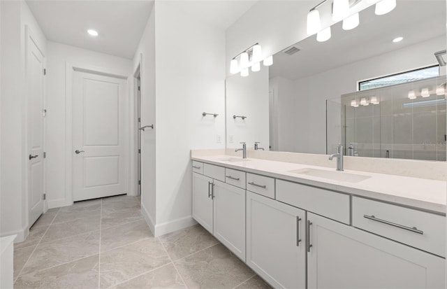 bathroom featuring an enclosed shower and vanity