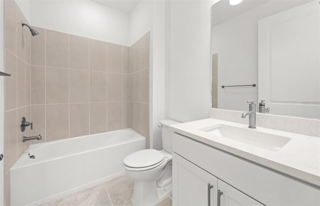 full bathroom with tiled shower / bath, vanity, tile patterned floors, and toilet