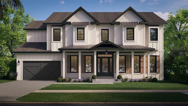 view of front of home featuring a front yard and a garage