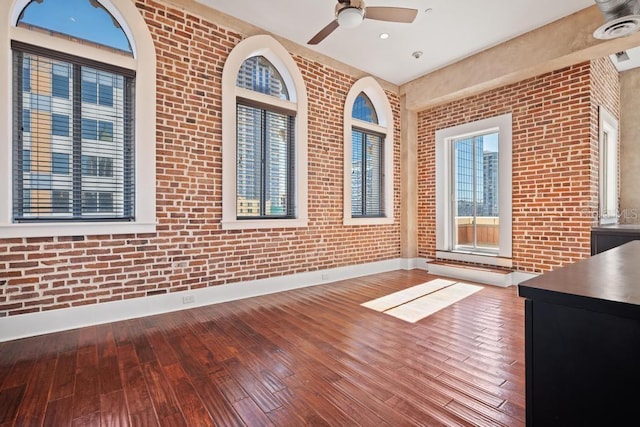 interior space with ceiling fan