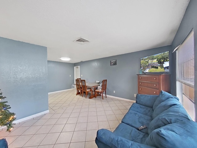 living room with light tile patterned floors