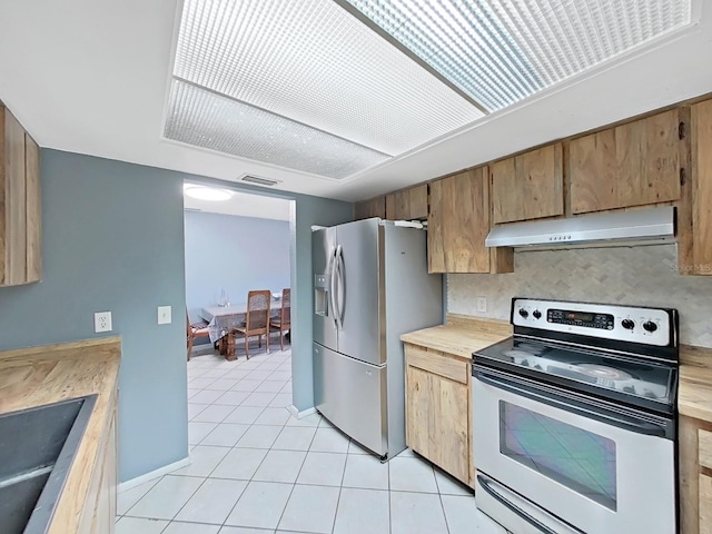 kitchen with stainless steel fridge with ice dispenser, sink, light tile patterned floors, and white electric stove