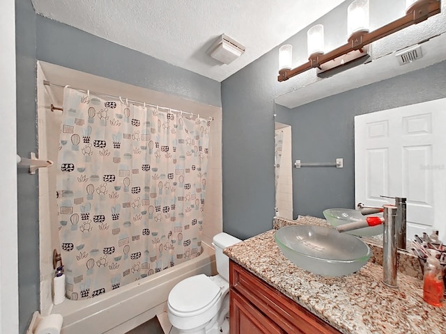 full bathroom with toilet, a textured ceiling, vanity, and shower / tub combo with curtain