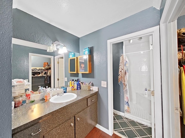 bathroom with vanity and walk in shower