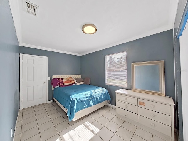 bedroom featuring light tile patterned floors and ornamental molding