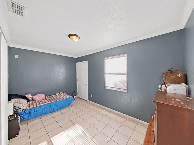 tiled bedroom featuring ornamental molding