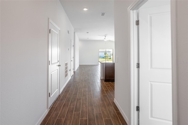 hallway featuring dark hardwood / wood-style flooring