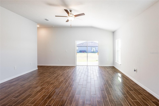 spare room featuring ceiling fan, dark hardwood / wood-style flooring, and lofted ceiling