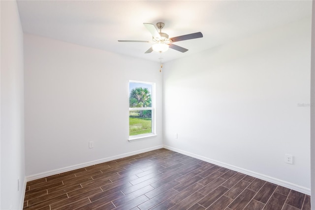 spare room featuring dark hardwood / wood-style floors and ceiling fan