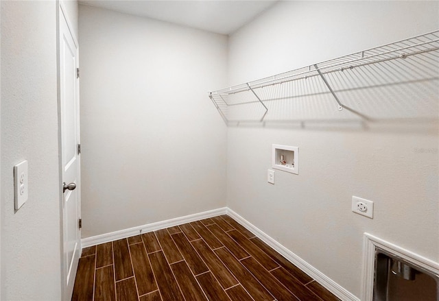 laundry area with hookup for an electric dryer, dark hardwood / wood-style floors, and hookup for a washing machine