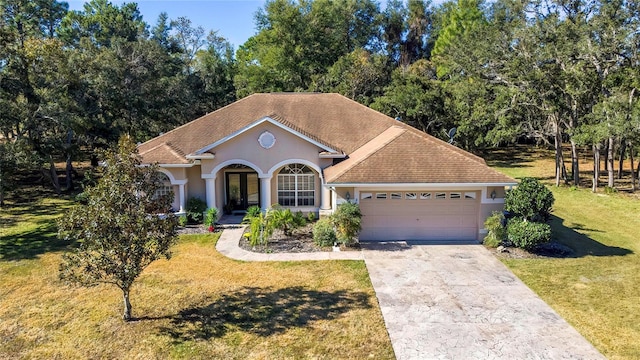 view of front facade with a front lawn and a garage