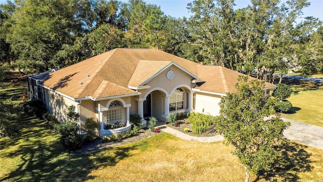 view of front of home with a porch and a front yard