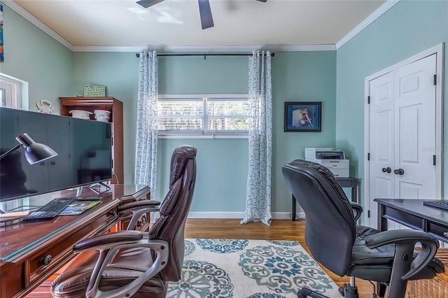 office space featuring crown molding, ceiling fan, and light hardwood / wood-style floors