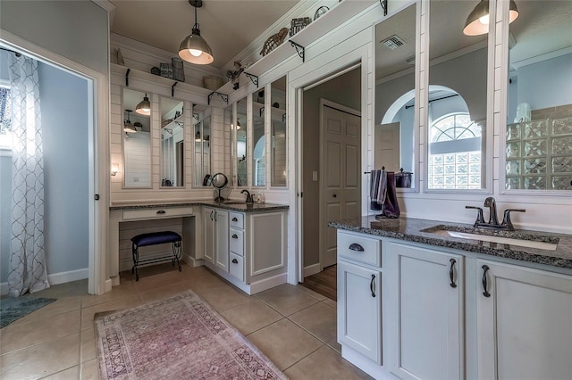 bathroom featuring tile patterned floors, vanity, and ornamental molding