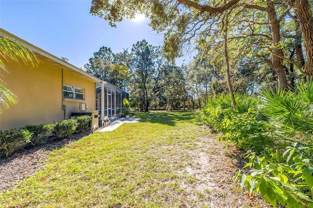 view of yard with a lanai