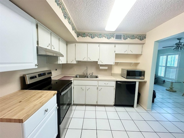 kitchen featuring white cabinetry, sink, a textured ceiling, and appliances with stainless steel finishes