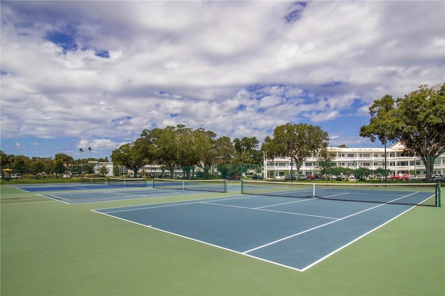 view of tennis court featuring basketball court