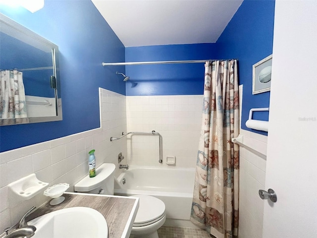 full bathroom with tile patterned floors, tile walls, shower / bath combo, and toilet