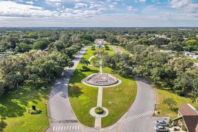 drone / aerial view featuring a wooded view