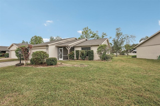 view of front of house featuring a front yard and a garage