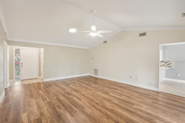 unfurnished living room featuring crown molding, ceiling fan, lofted ceiling, and light wood-type flooring