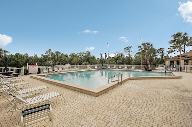 view of swimming pool featuring a patio