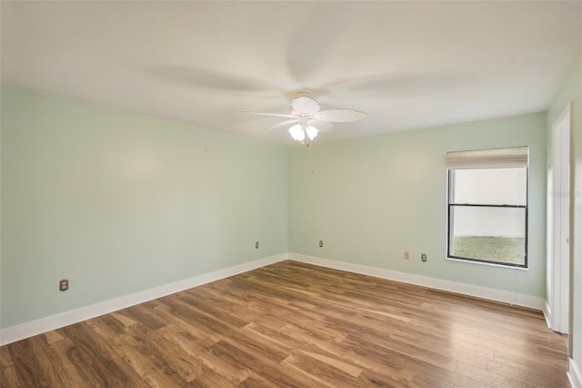 spare room with ceiling fan and hardwood / wood-style floors