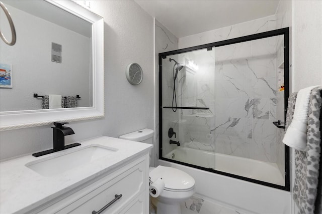 full bathroom with vanity, toilet, and combined bath / shower with glass door