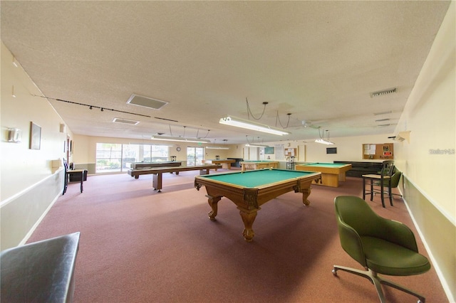 recreation room with a textured ceiling and billiards