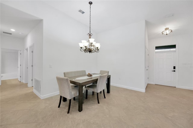 tiled dining space with an inviting chandelier