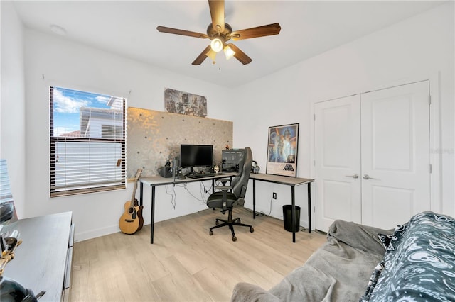 office space featuring ceiling fan and light hardwood / wood-style floors