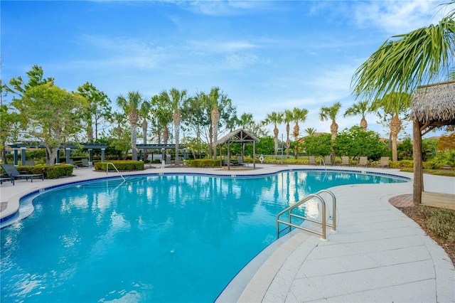 view of swimming pool featuring a pergola and a patio