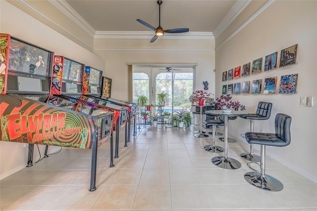 game room featuring ceiling fan, light tile patterned floors, and crown molding