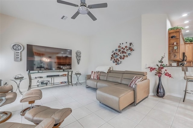 tiled living room featuring ceiling fan